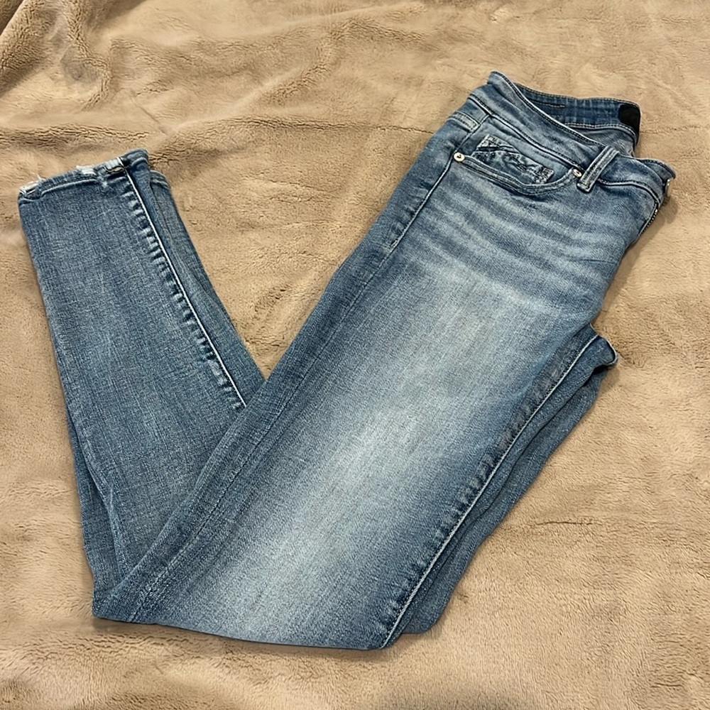 Buckle Black Skinny Jeans. Size 25.